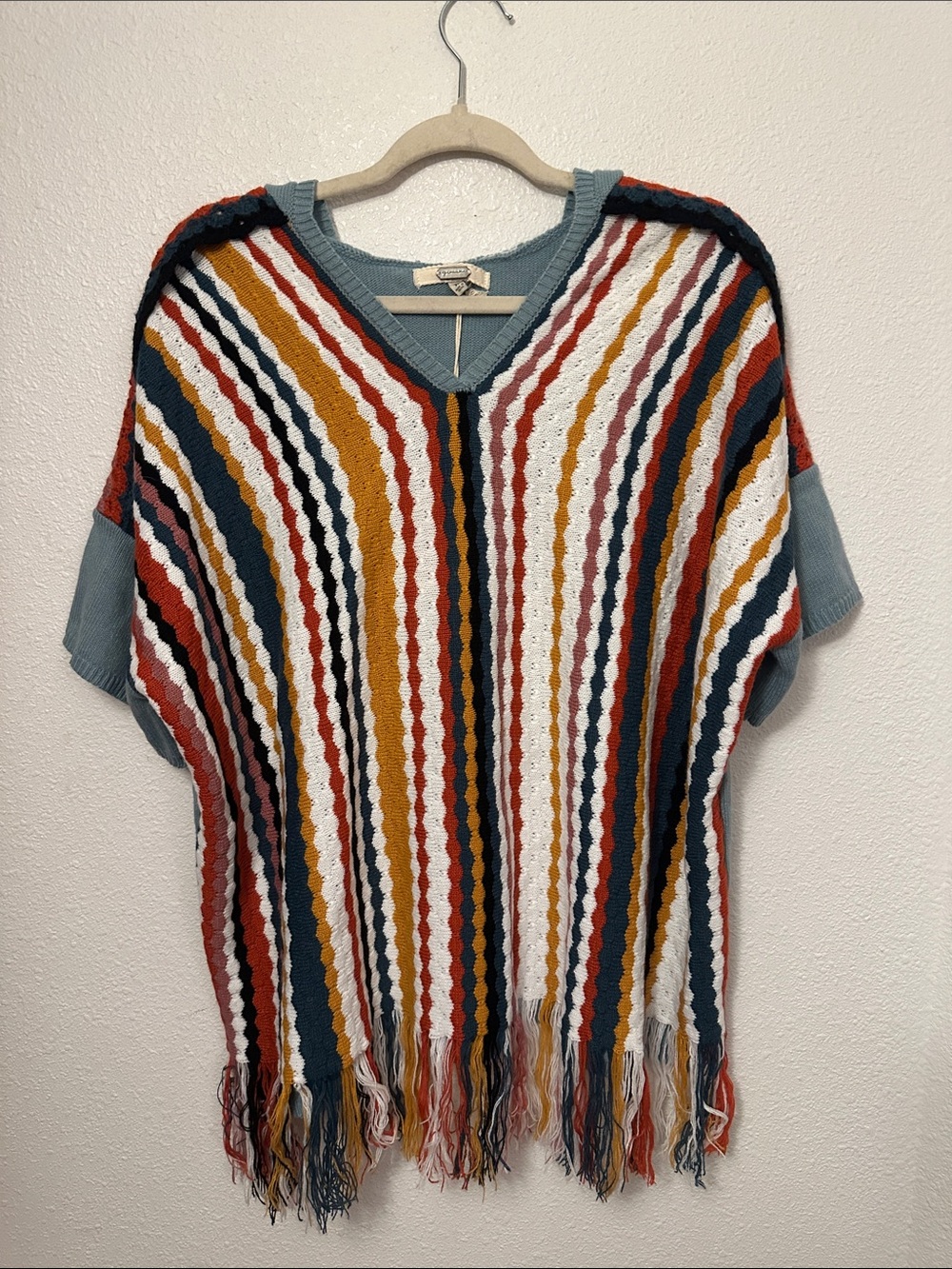 gimmicks by BKE Striped Fringe V-Neck Poncho in Blue, White, Mustard, Rust